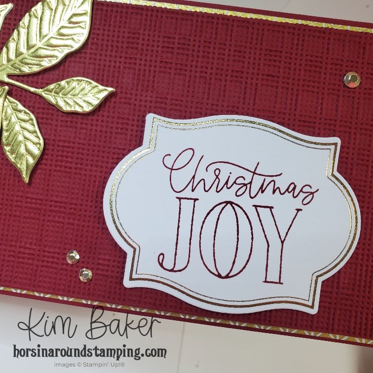 close up of hot foiled Christmas Joy sentiment plus textured layer